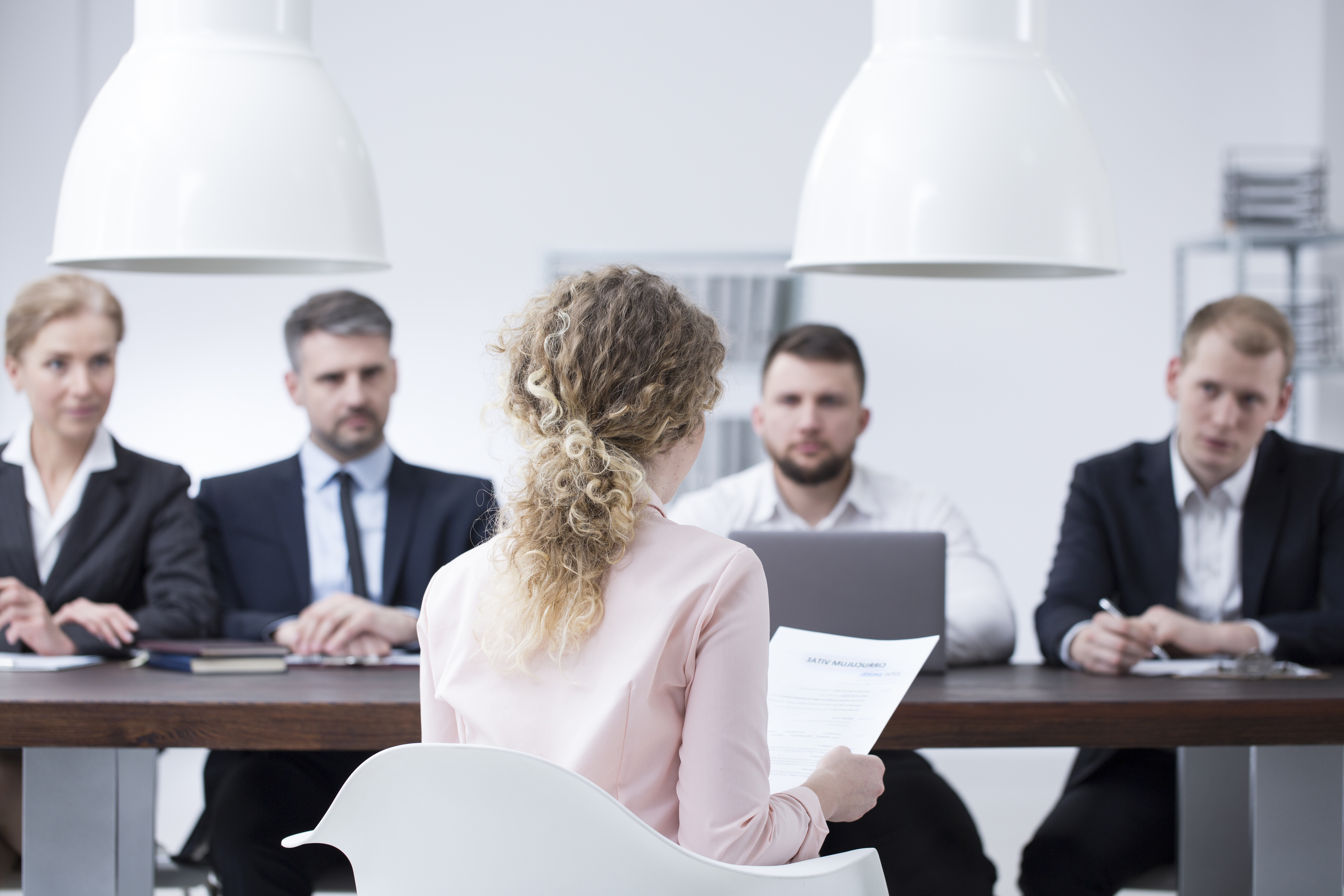 woman presenting a dissertation in front of committee