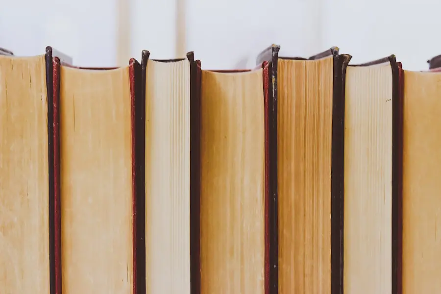 close up of a horizontal stack of books