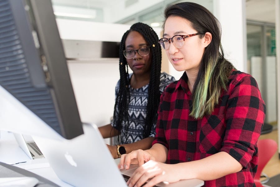 two women working together in an office