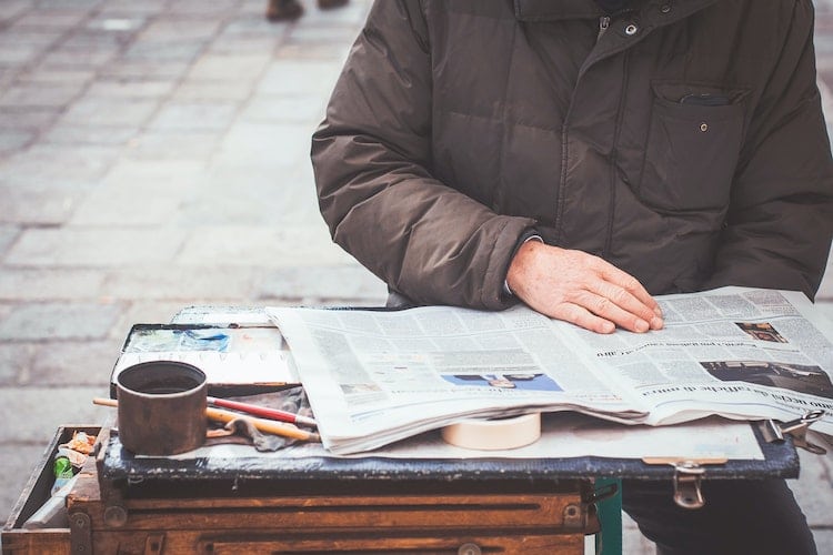 apa citation newspaper article no author senior citizen reading a newspaper outside