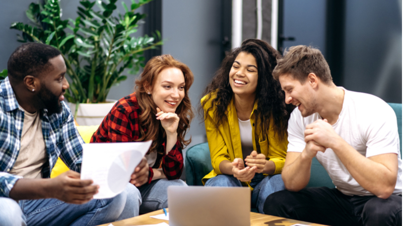 group of multicultural colleagues working on a survey