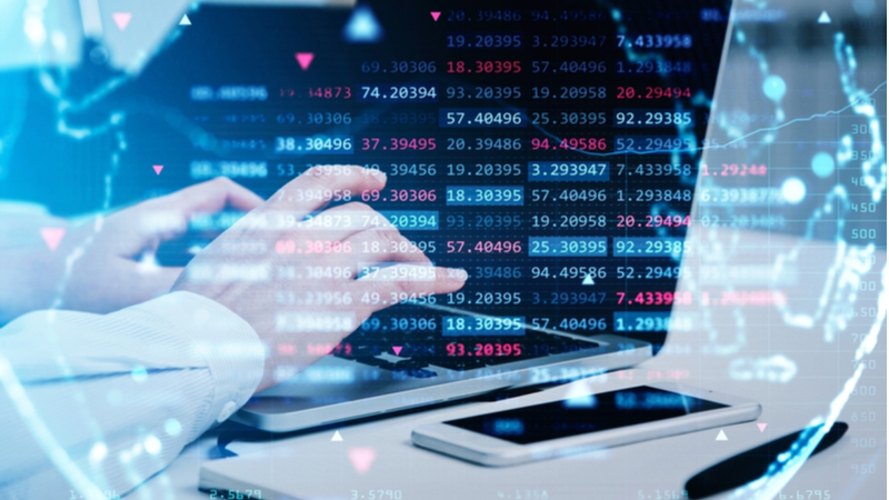 man typing on a laptop with decimal numbers overlaid on top