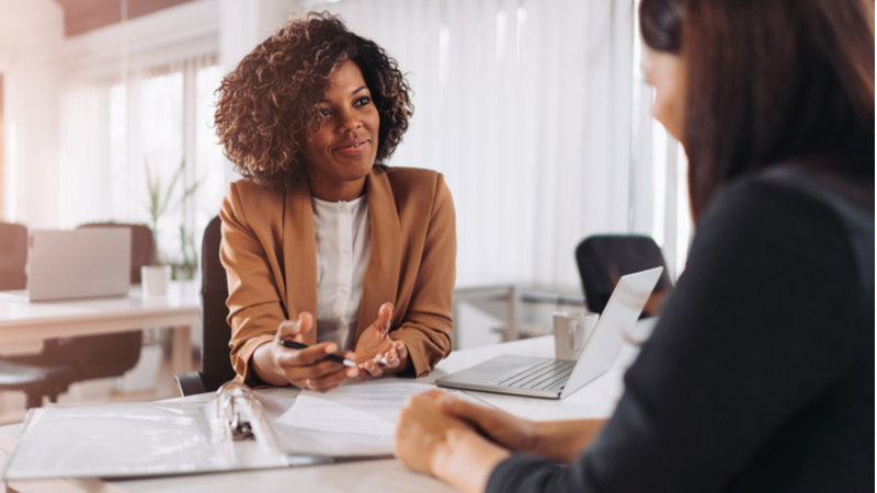 young african american woman with curly hair on a job interview