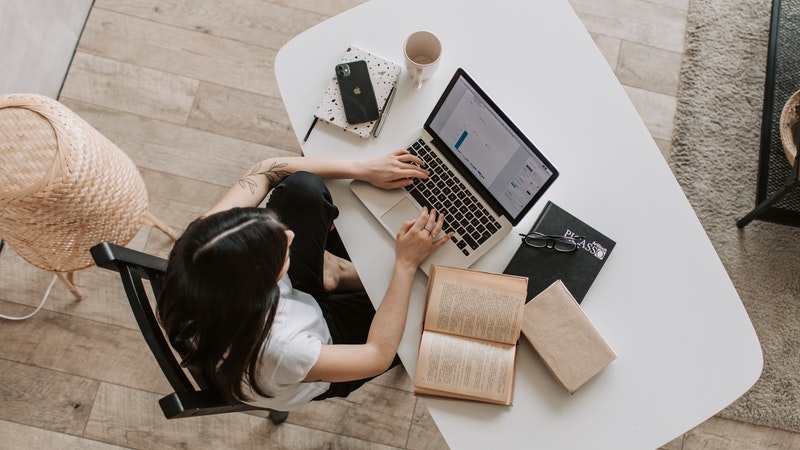 top view of a woman studying in her home office