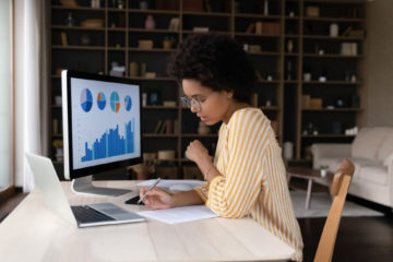 focused grad student working on her computer