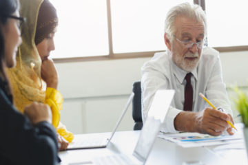 professor consulting students in his office