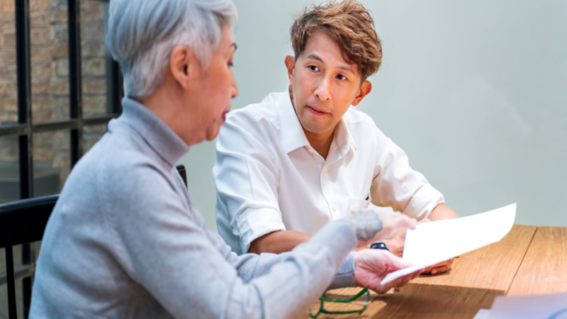 student consulting a college professor