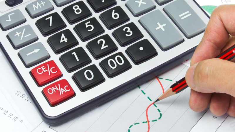 close-up of math charts next to a calculator