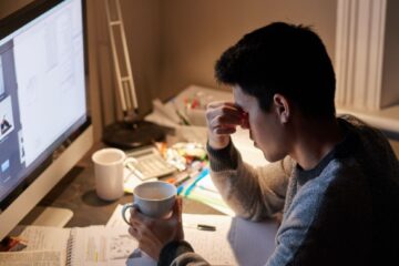 stressed out phd student in front of the computer